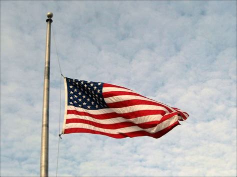 Why will flags be at half-staff during Thanksgiving weekend?